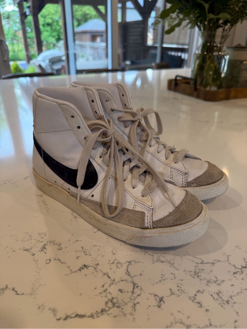 Nike High-Top White Sneakers with Black Swoosh and Gray Suede